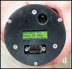 Read the moisture content from the display window at the base of the instrument