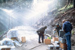 photo of a field crew simulating rainfall on a road